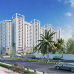 Modern High-Rise White Towers Of Askari Towers Karachi In Cantt, With Palm Trees, Landscaped Road And Vehicles