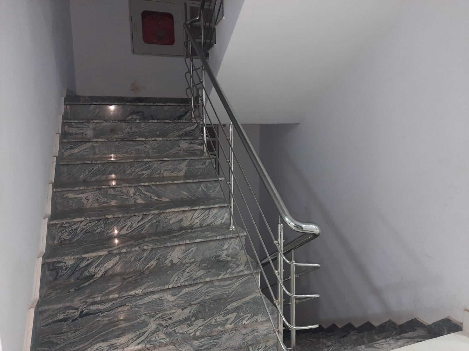 Dunes Marvel 3-Bedroom Apartment for Sale in Clifton Block 5 Karachi (4) Marble staircase with stainless steel railing in Dunes Marvel Clifton Block 5 Karachi