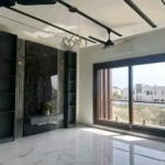 Spacious Living Room In Luxurious 500 Sqyd House For Sale, Dha Phase 8 Karachi, Modern Black Feature Wall, Built-In Cabinets,