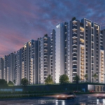 Saima Shield Towers Luxury High-Rise In Gulshan-E-Iqbal, Modern Towers With Glass Facades, Lit Windows, Palm Trees, And Dusk