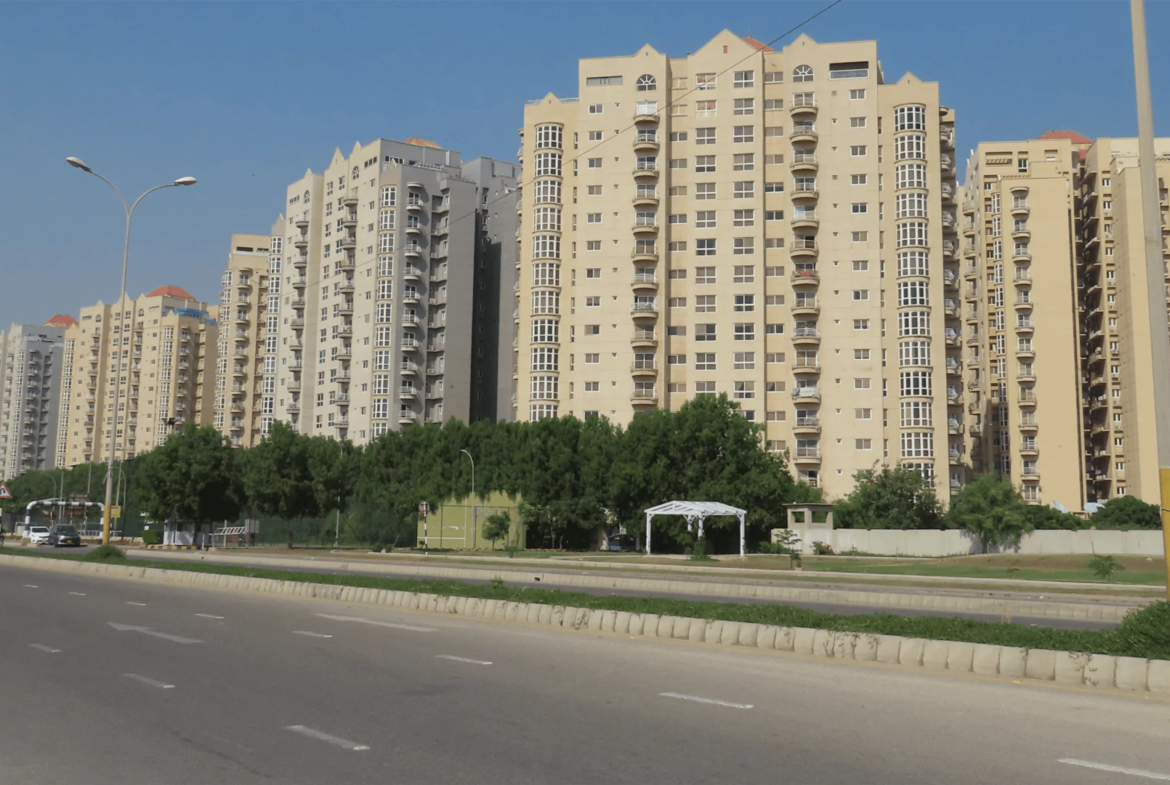 Stunning exterior view of the fully renovated Creek Vista apartments in DHA Phase 8 Karachi, showcasing modern architecture against a scenic backdrop