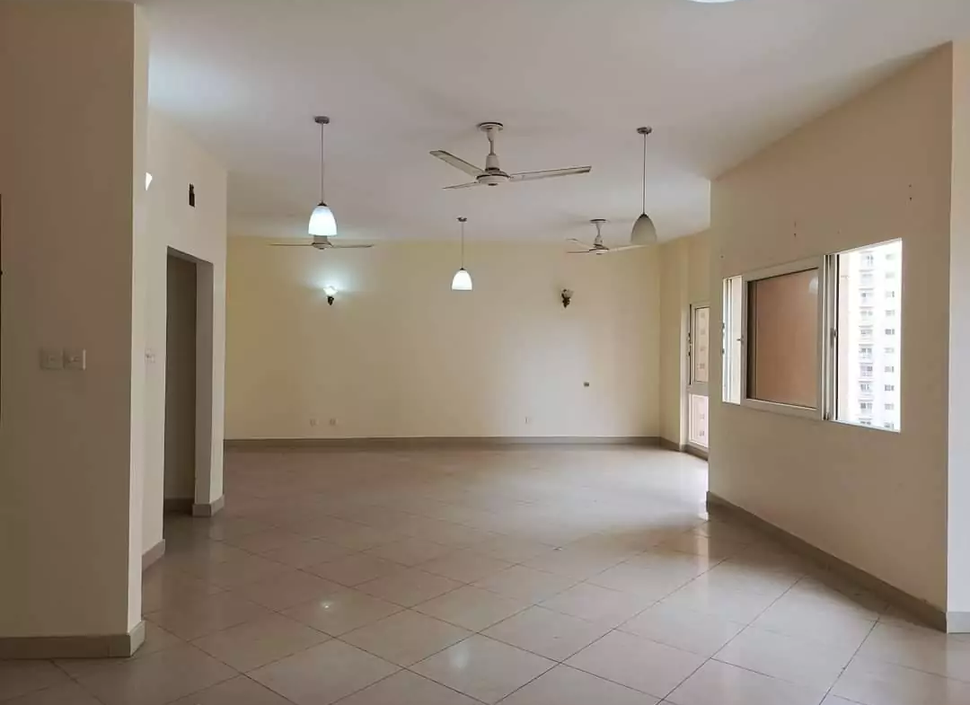 Elegant living room interior of the Creek Vista apartment, featuring contemporary furnishings and ample natural light