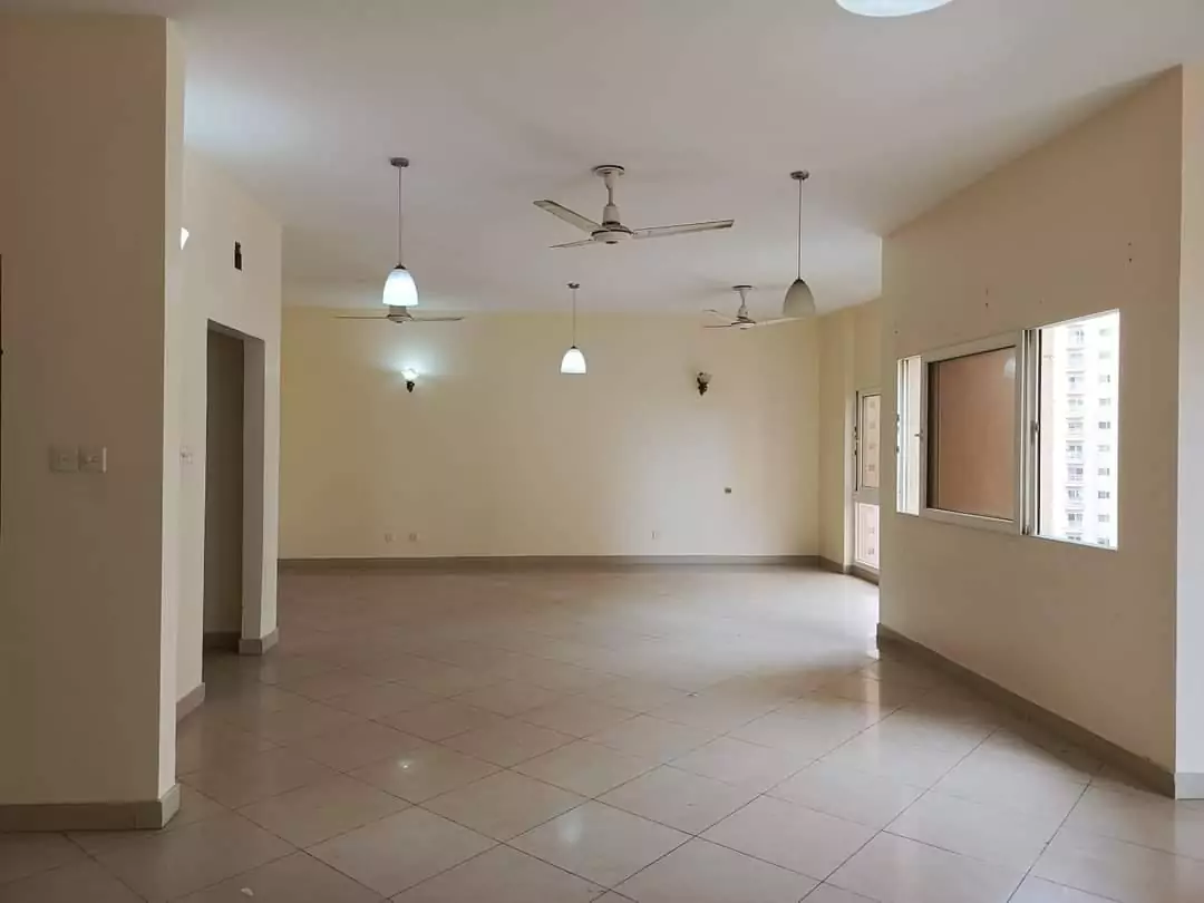 Elegant living room interior of the Creek Vista apartment, featuring contemporary furnishings and ample natural light