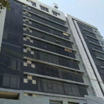Multi-Story Luxury Office Building Facade In Clifton Diamond, Featuring Tinted Glass Windows, White Panels, And Modern Design