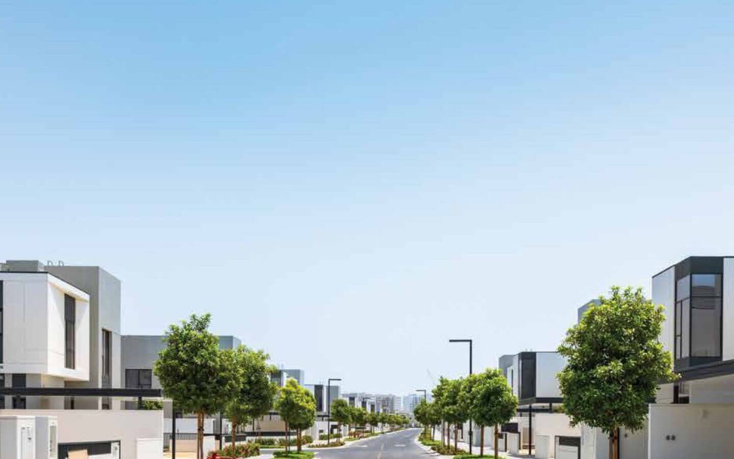 Askari Villas Karachi 270 Sq Yd Luxury by MaxX Capitals (2) Modern white villas with glass facades lining palm-tree avenue in Askari Villas Karachi