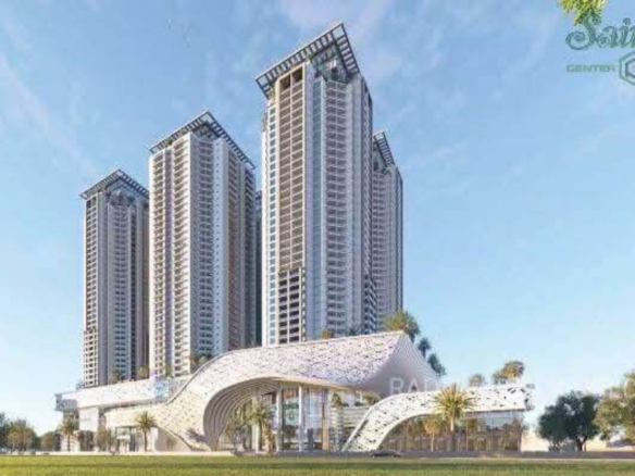 Modern High-Rise Towers And Curved Entrance Pavilion At Saima Center Point Pre-Launch On Jinnah Road, Karachi, With Palm Tree