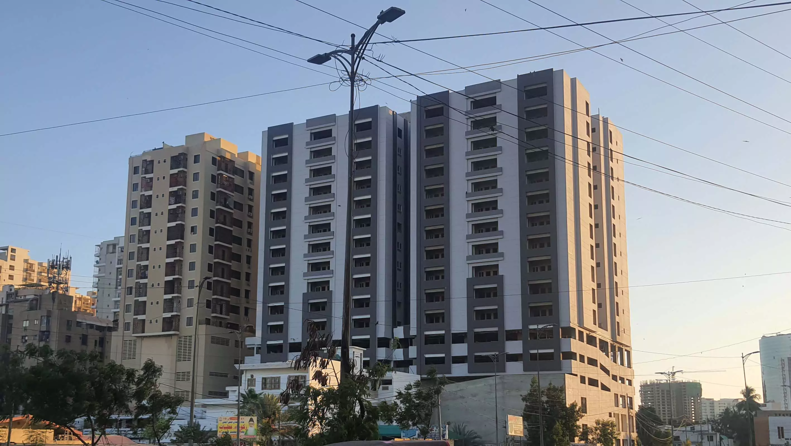 Metro Central Plaza Block 9 Clifton Multi-story grey high-rise towers of Metro Central Plaza with balconies and surrounding urban buildings