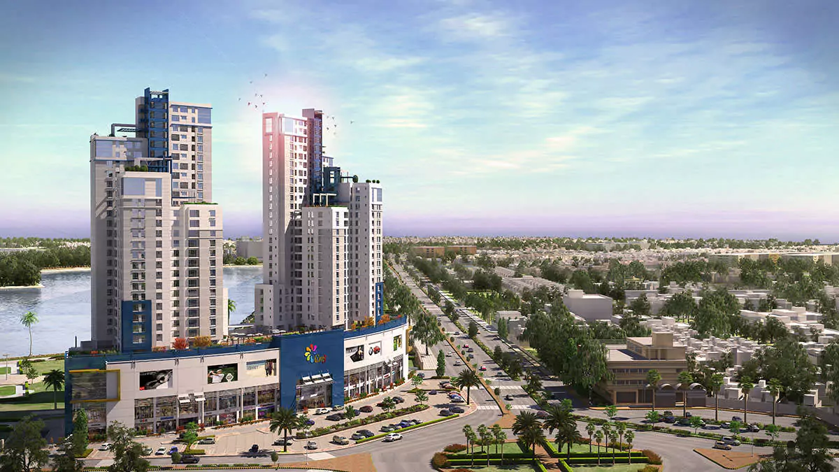 Luxury Living 4 Bedrooms Flat for Rent In COM3 Tower Clifton Block 6 Karachi (1) Aerial view of COM3 Tower in Clifton with luxury high-rise towers, curved commercial podium, palm trees, roundabout, and adja