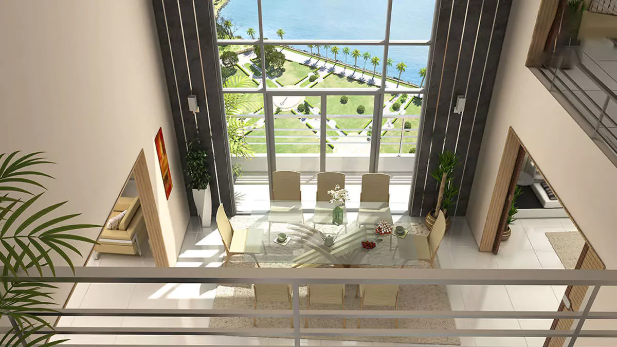 Luxury Living 4 Bedrooms Flat for Rent In COM3 Tower Clifton Block 6 Karachi (12) Spacious dining area with sea view in luxury 4-bedroom flat for rent, Com3 Tower Clifton, glass table, white chairs, plants