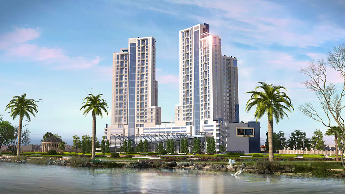 Luxury Living 4 Bedrooms Flat for Rent In COM3 Tower Clifton Block 6 Karachi (2) Twin modern high-rise towers of COM3 in Clifton with glass facades, palm trees, landscaped gardens, and waterfront
