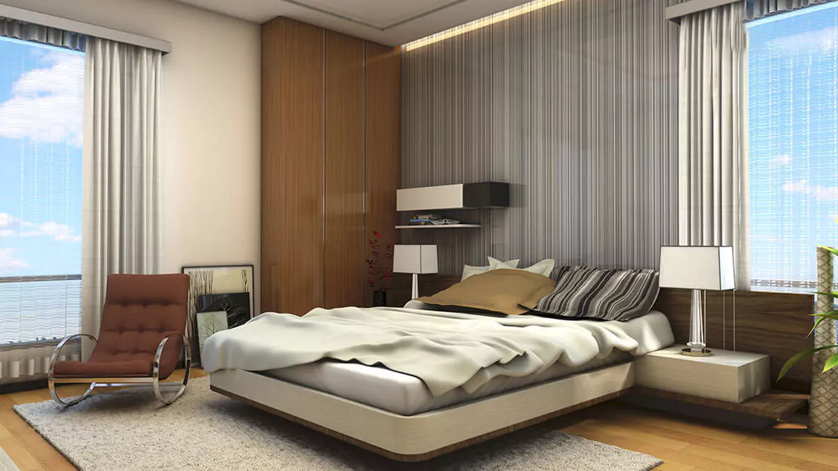 Luxury Living 4 Bedrooms Flat for Rent In COM3 Tower Clifton Block 6 Karachi (8) Spacious master bedroom in luxury 4-bedroom flat for rent in COM3 Tower Clifton with king bed, wooden wardrobes, red armchair