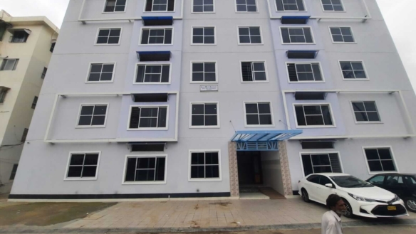 Dunes Marvel Residency Multi-Story Apartment Building Exterior In Clifton Block 5 Karachi With White Facade And Windows