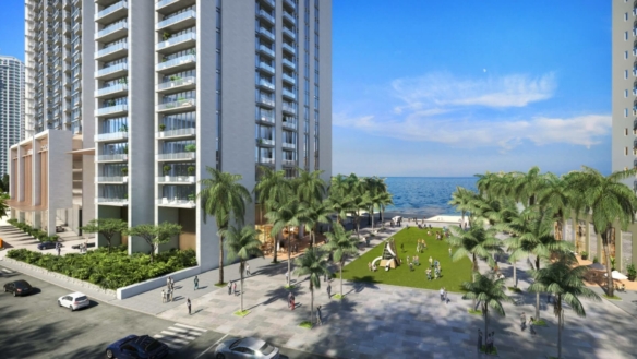 Tall Modern High-Rise Apartments At The Views By Emaar In Karachi, Waterfront With Sea Views, Palm Trees, Green Lawns, And Pe