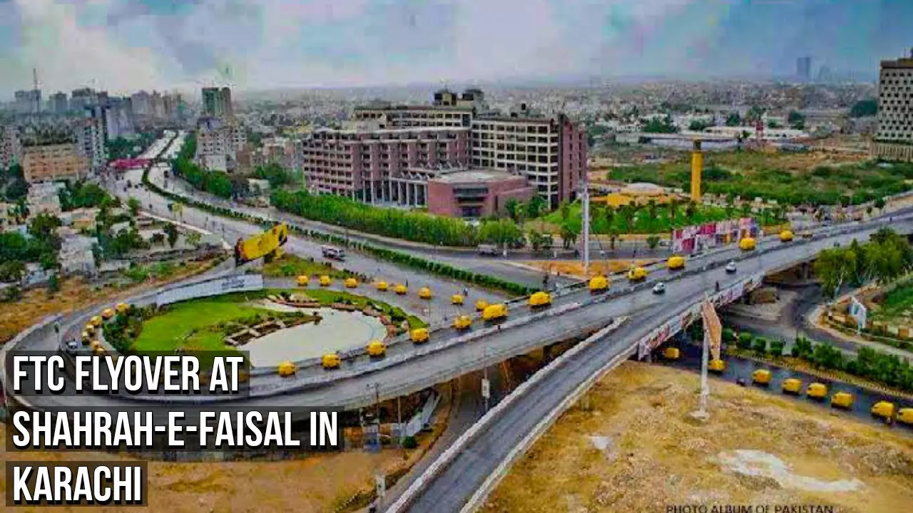 Smart Tower 2 Prime Location Offices for Sale in Karachi (2) Aerial view of FTC flyover at Shahrah-e-Faisal near Smart Tower 2 in Karachi, with highways, modern buildings, and green roun