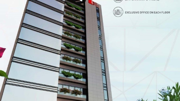 Smart Tower 2 Office Tower In Karachi With Sleek Glass Facade, Green Balcony Planters, And Modern Entrance