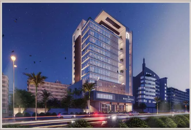 Prime Commercial Spaces for Sale in Gulshan-e-Iqbal, Karachi The Business Lounge (5) Nighttime view of The Business Lounge modern commercial building with glass facade, illuminated signage, palm trees, and urba