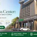 Saima Business Center In Clifton, Featuring A Modern High-Rise Design, Large Glass Windows, And Ample Parking Space.