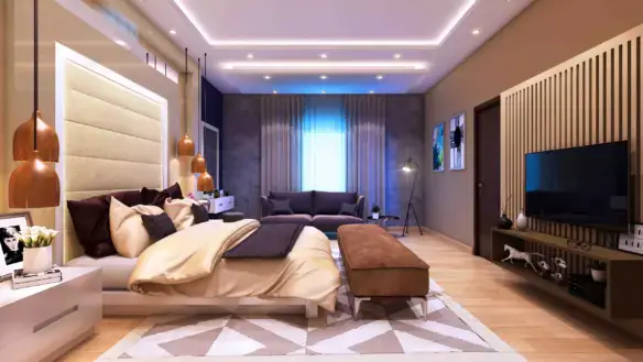Spacious master bedroom in Victoria Residency apartments Karachi with king bed purple sofa mounted TV wooden floors and LED l
