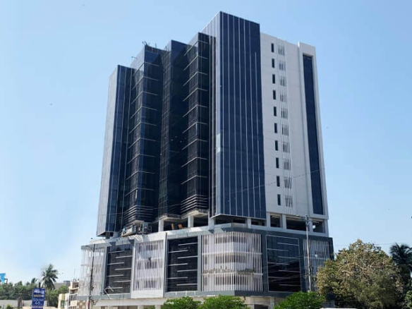 Emarah Suites Karachi Modern High-Rise Exterior With Black Glass Panels, White Frames, Scaffolding, And Palm Trees