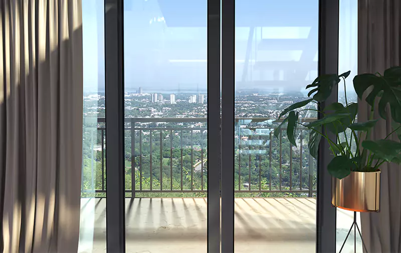Titan One Luxury Flats Duplex Apartments & Penthouses For Sale In Callachi Co-Operative Housing Society Karachi (6) MaxX Capitals interior view of Karachi luxury apartment balcony with city skyline and glass doors