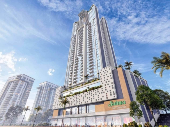 Salima Waterpark High-Rise Tower With Modern Glass Facade, Balconies, Palm Trees, And Adjacent Buildings Under Blue Sky