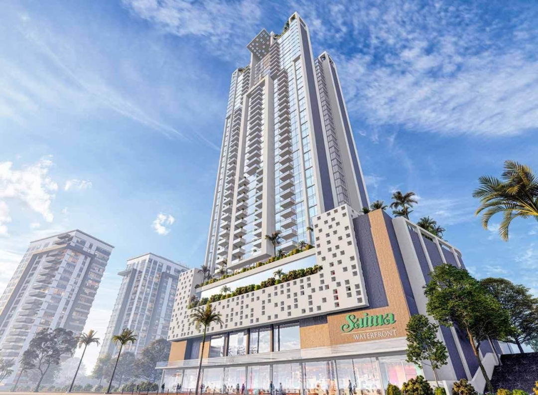 Salima Waterpark high-rise tower with modern glass facade, balconies, palm trees, and adjacent buildings under blue sky