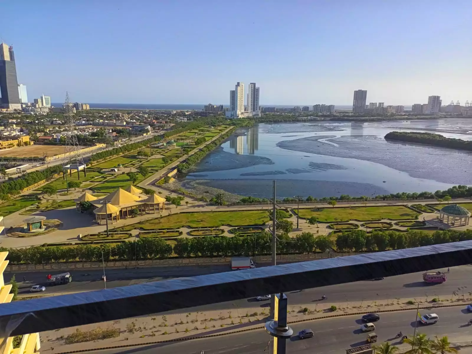 Clifton Marina Karachi 3 & 4 Bedroom Luxury Flats For Sale In Clifton Block 7 Near Boat Basin (9) Entrance hallway with geometric wooden doors, mirrored sliding wardrobe doors, and beige marble flooring in Clifton Marina Ka