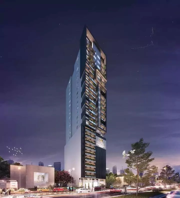 Pacific Residency Clifton Luxury 3-Bedroom Apartments For Sale In Block 7 Clifton Karachi Exclusive Community (2) Night view of Pacific Residency Clifton luxury high-rise tower with modern glass facade, balconies, greenery, and urban stree