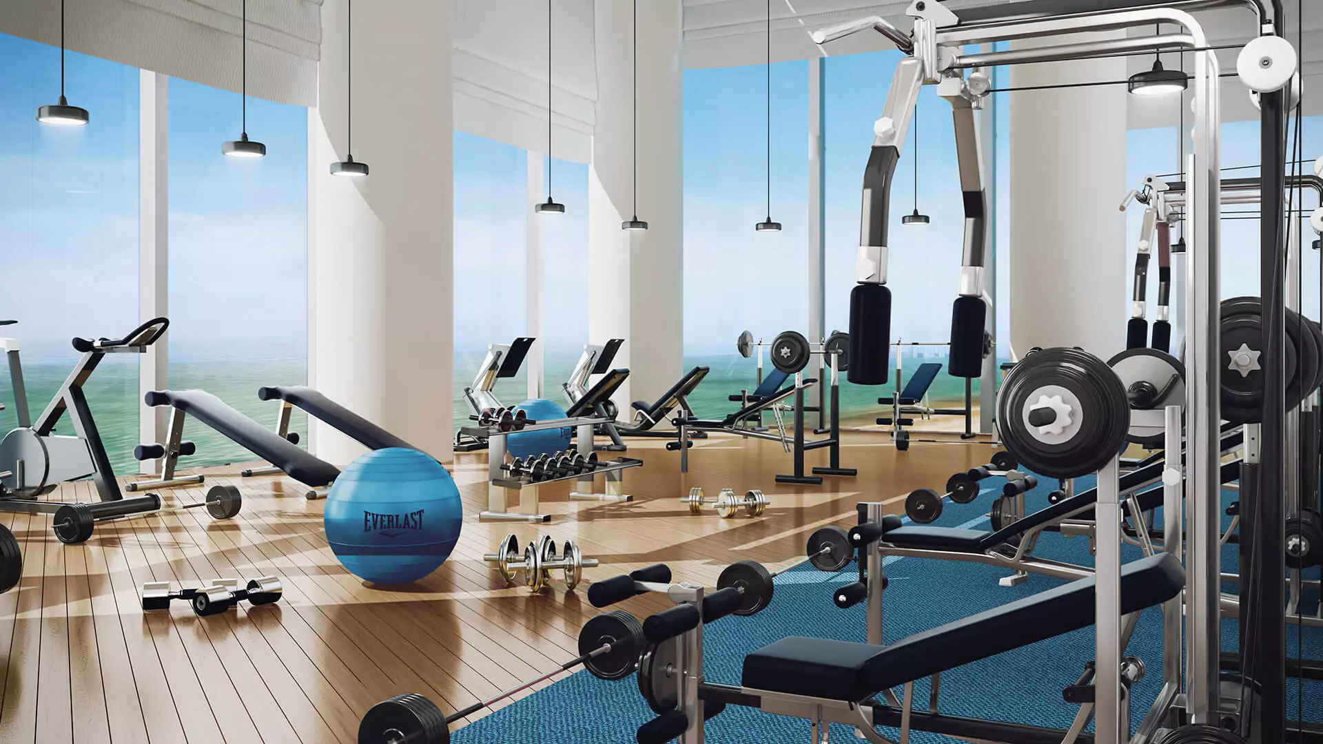 Gym Space Country Finance Tower Luxury Offices For Sale in Clifton Block 4 Karachi Spacious modern gym in Country Finance Tower Clifton with treadmills weights benches exercise bikes blue stability ball sea v