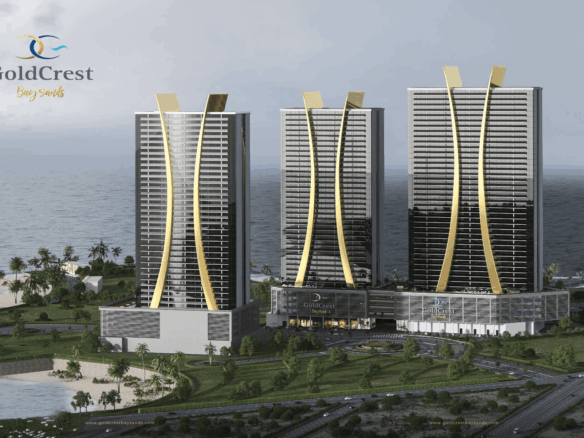Three Curved High-Rise Towers Of Goldcrest Bay Sands With Gold Accents On Waterfront Overlooking Sea And Beach