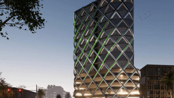 Modern High-Rise Tower With Glowing Green Geometric Lattice Facade At Dusk, Palm Trees, Urban Street And Adjacent Buildings