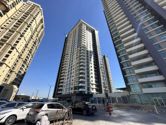 Modern High-Rise Apartment Towers In Emaar Pearl With Glass Facades, Balconies And Sunny Exterior View