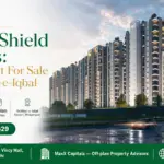 Modern High-Rise Residential Towers Of Saima Shield Towers In Gulshan-E-Iqbal With Illuminated Balconies And Landscaped Surro
