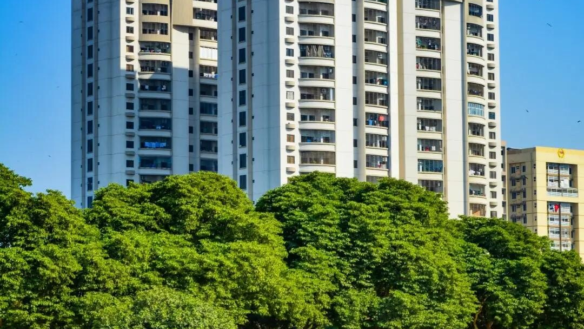Zamzam Towers High-Rise Apartments In Civil Lines Karachi With White Facades Balconies And Lush Green Trees Landscaping