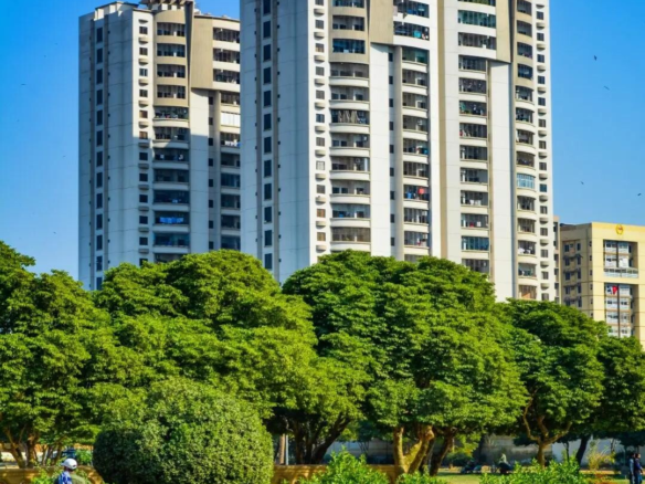 Zamzam Towers High-Rise Apartments In Civil Lines Karachi With White Facades Balconies And Lush Green Trees Landscaping