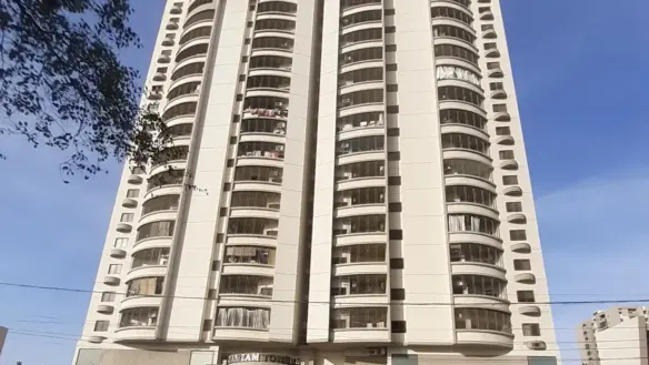 Modern High-Rise Apartment Building Gulistan Jamal In Civil Lines Karachi With Curved Towers Balconies And Gated Entrance