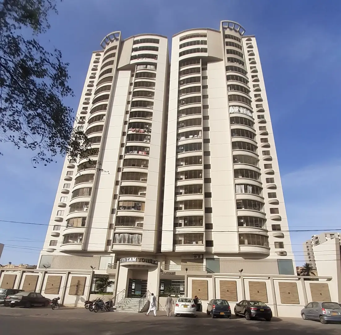 Modern high-rise apartment building Gulistan Jamal in Civil Lines Karachi with curved towers balconies and gated entrance