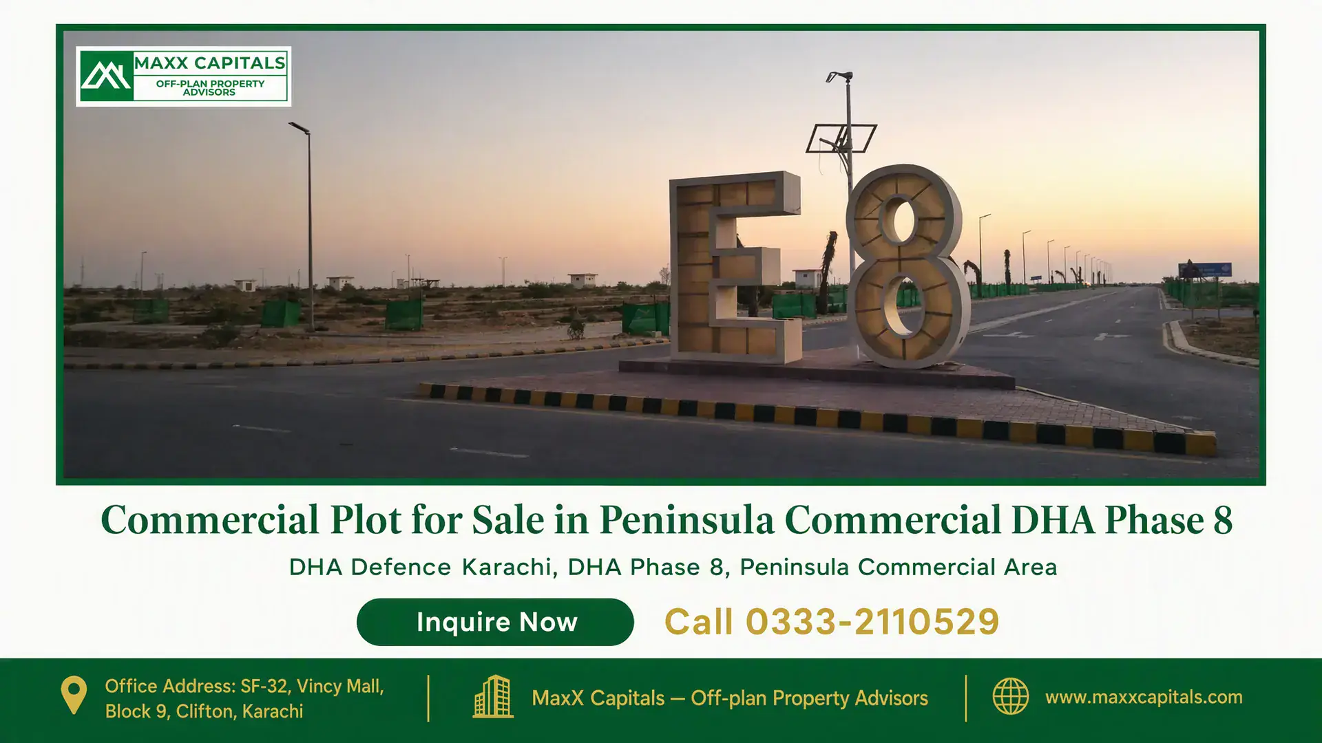 Commercial Plot for Sale in Peninsula Commercial DHA Phase 8 Landmark E8 structure at sunset in Peninsula Commercial DHA Phase 8 surrounded by paved roads and green fencing.