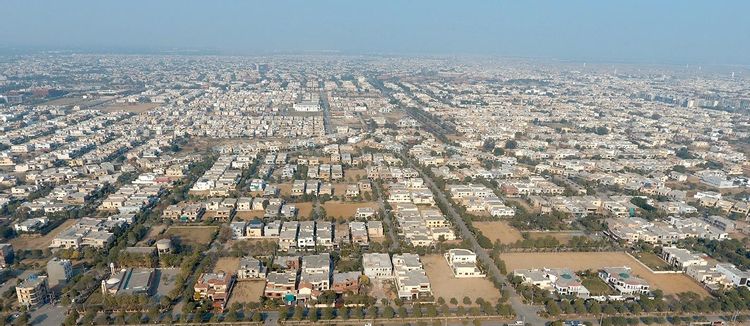 Prime Commercial Plot for Sale in Peninsula Commercial, DHA Phase 8 Karachi (2) Aerial view of commercial plots and buildings in Peninsula Commercial DHA Phase 8 with wide streets and open spaces