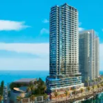 H&Amp;S Residence In Dha Phase 8: Modern High-Rise Towers With Glass Facades Overlooking Sea, Palm-Lined Promenade And Waterfront