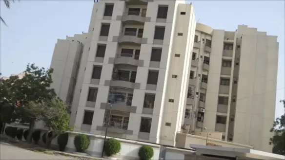 Bath Island Pride Luxury Building In Clifton, Multi-Story White Facade With Balconies, Large Windows, Trees And Hedges