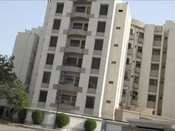 Bath Island Pride Luxury Building In Clifton, Multi-Story White Facade With Balconies, Large Windows, Trees And Hedges