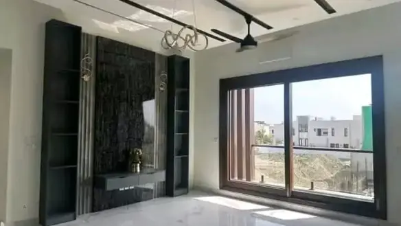 Spacious Living Room In Luxurious 500 Sqyd House For Sale, Dha Phase 8 Karachi, Modern Black Feature Wall, Built-In Cabinets,