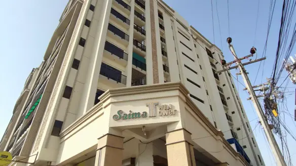 Saima Twin Towers Exterior In Kda Scheme 1, Multi-Story Beige Building With Balconies, Pillars At Entrance, And Signage