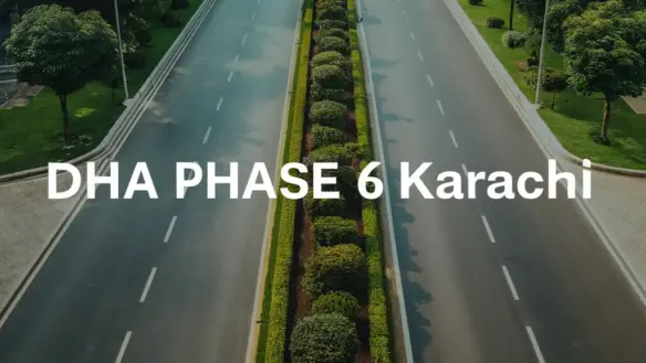 Wide Tree-Lined Boulevard With Manicured Hedges And Dha Phase 6 Karachi Signage In Luxurious Residential Area