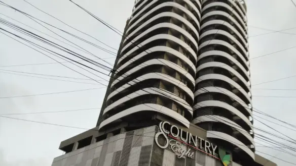 Modern Twin-Tower Apartment Building In Country 8 Clifton With Curved White Facades, Balconies, And Dark Accents