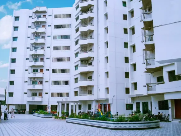 Mehran Twin Towers Exterior In Civil Lines: Multi-Story White Building With Balconies, Ac Units, And Ground-Level Courtyard W