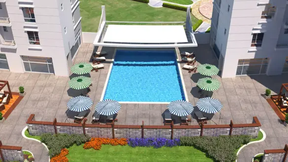 Twin Modern High-Rise Towers Of Com3 Tower Clifton With Waterfront, Palm Trees, And Landscaped Gardens