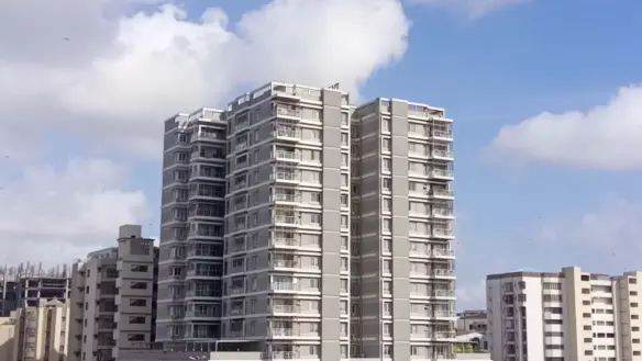 Dany Icon Luxury High-Rise Towers In Civil Lines, Modern Grey Multi-Story Building With Balconies Amid Urban Surroundings