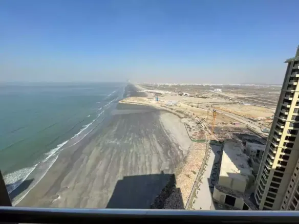 Expansive Sea-Facing View From Luxury Flat In Pearl Tower 3 Emaar, Showing Ocean, Beachfront, Construction, And High-Rises